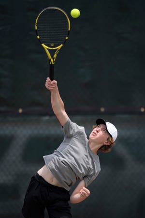 Topeka West's James Maag serves the ball at the state tournament on Friday May.  13, 2022, at Kossover Tennis Court in Topeka, Kan.