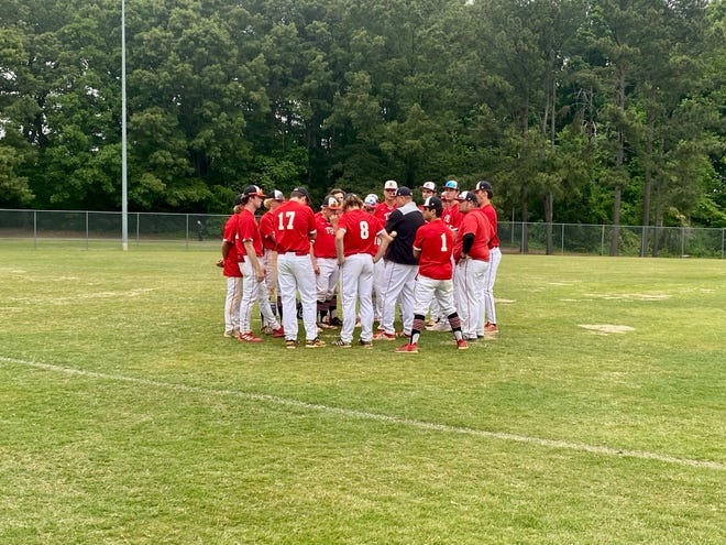 The Burlington School baseball team huddles for a postgame conversation following an 11-0 victory in five innings against Trinity School of Durham and Chapel Hill in the second round of the NCISAA state playoffs.