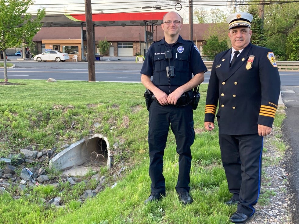 South Plainfield police officer Brian Zielinski and South Plainfield Deputy Fire Chief Lawrence DelNegro at the Durham Avenue site where they rescued a family from Hurricane Ida floodwaters