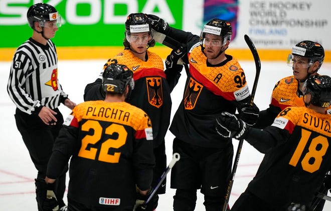 Red Wings defenseman Moritz Seider celebrates after scoring a goal against Canada in Friday's opening game of the world hockey championships in Helsinki, Finland.