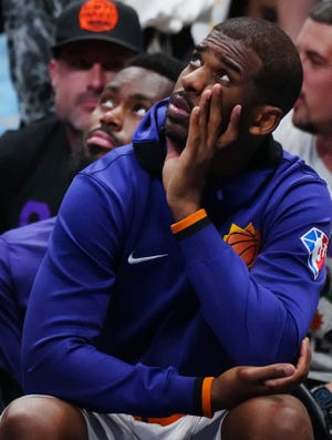 May 12, 2022;  Dallas, Texas;  USA;  Suns guard Chris Paul looks up at the scoreboard from the bench against the Mavericks during game 6 of the second round of the Western Conference Playoffs.