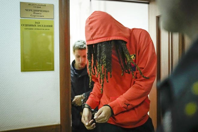 WNBA star and two-time Olympic gold medalist Brittney Griner leaves a courtroom after a hearing, in Khimki just outside Moscow, Russia, Friday, May 13, 2022.
