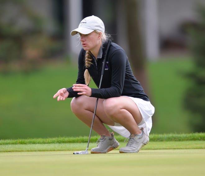 Albany's Abby Thelen looks at her line before her putt as the girls golfers competed at the St. Cloud Country Club on Thursday, May 12, 2022.  