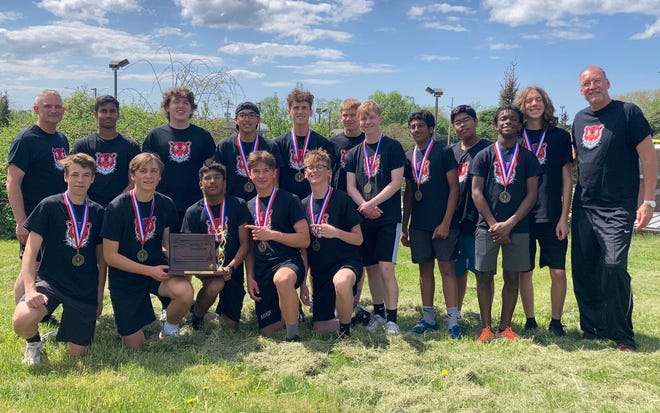 Fairview coach Rick Sertz, right, poses with his Fairview boys tennis team after the Tigers won the District 10 Class 2A championship on Friday, May 13, 2022, at Westwood Racquet Club.Sertz announced that he was resigning as boys tennis coach after the season .