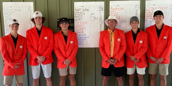Coach Jack Carpenter, fourth from left, and his Warsaw Tigers golf team show off the orange blazers they received for winning the 86th Uebele Invitational Friday at Beechwood Golf Course in LaPorte. The Tigers, who entered the tournament unranked in the state's Top 20 coaches poll, totaled 308 strokes to beat No. 12 Crown Point by two strokes and No. 13 Valparaiso by four strokes. The 22-team event began at the par-72 Beechwood in 1937 and has been held every year except 2020 when the COVID-19 pandemic intervened. The members of the team with their scores in parentheses are, from left, Aidan Bowell (77), Ben Brander (77), Cal Hoskins (71), Carpenter, Lewis Turley (83) and Jaxson Gould (89).