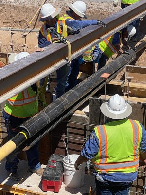 Las Cruces Utilities crews install natural gas pipe in this undated photo.