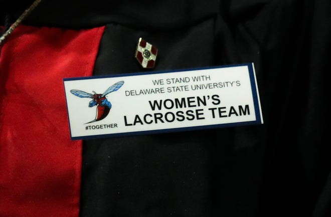 Pins supporting the women's lacrosse team were a common sight among graduates and other attendees during Delaware State University's 2022 commencement ceremonies in Memorial Hall, Saturday, May 14, 2022.
