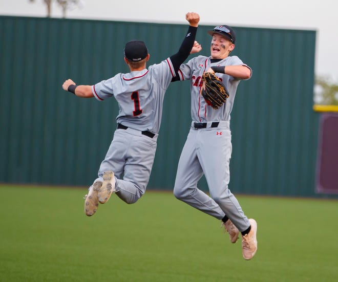 Lake Travis' Preston Marshall, left, and Daniel Ripple celebrate the Cavs' win over San Antonio Johnson in Game 3 of the Class 6A Region IV area-round playoff series Saturday at Dripping Springs. The Cavs rolled to an 8-0 win to advance to the third round.