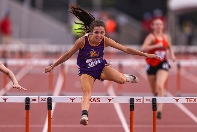 Moran's Alli Scott competes in the girls 1A 300 meter hurdles on Saturday.