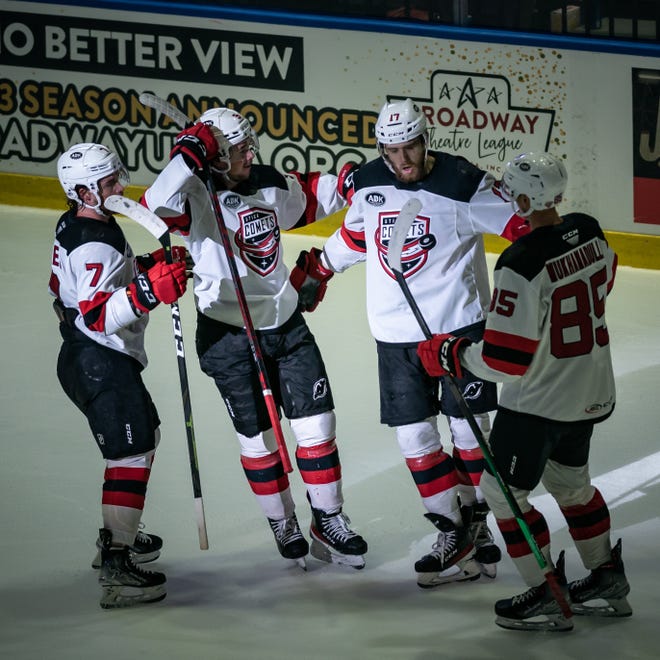 AJ Greer (17) celebrates with his teammate after scoring against the Rochester Americans during the 2022 Calder Cup Playoffs on Saturday, May 14, 2022 at the Adirondack Bank Center in Utica.