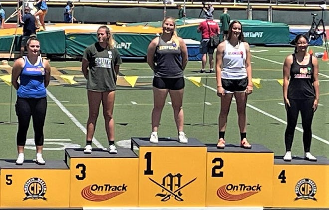 Hesperia's Jinelle Stiber stands atop the podium after taking first place in the girls discus at the CIF-Southern Section track and field championships at Moorpark High School.