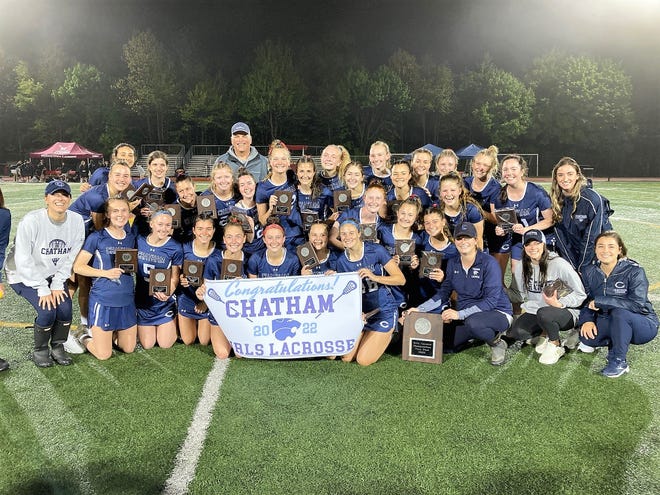 The Chatham girls lacrosse team celebrates after defeating Morristown, 11-8, to defend its Morris County Tournament title on May 14, 2022 at Mount Olive High School.