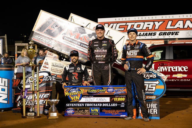 Brent Marks, center, is shown after Saturday's Morgan Cup victory at Williams Grove Speedway. He is flanked by second-place finisher Sheldon Haudenshild, right, and third-place finisher Rico Abreu.