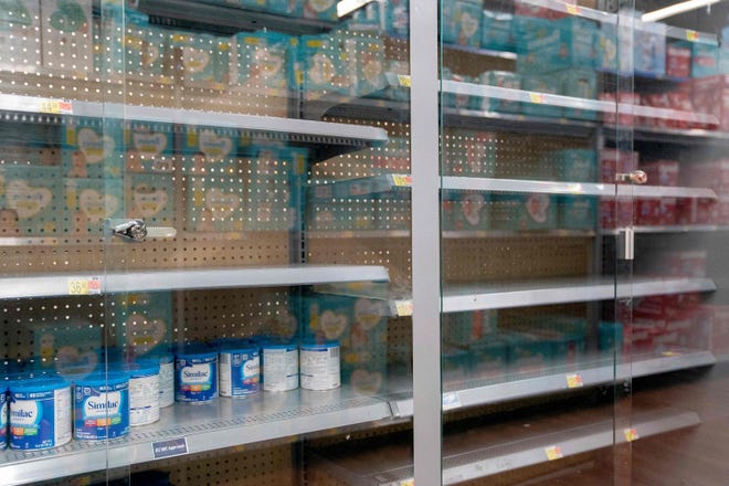 Grocery store shelves where baby formula is typically stocked are locked and nearly empty in Washington, D.C., on Wednesday, May 11, 2022. (Stefani Reynolds/AFP/Getty Images/TNS)