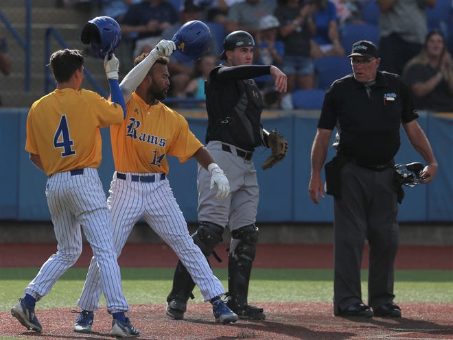 Angelo State University's Austin Beck, far left, and Koby Kelton celebrate after Kelton's two-run home run against West Texas A&M in the Lone Star Conference Baseball Tournament finals at Foster Field at 1st Community Credit Union Stadium on Saturday, May 14, 2022.