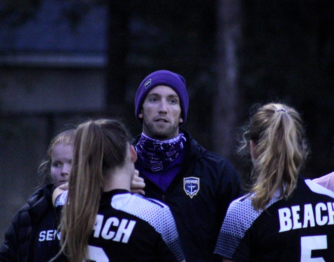 Fletcher High School girls soccer coach Bradley Plummer (center) gives instructions to players before the Gateway Conference championship on January 15, 2021. [Clayton Freeman/Florida Times-Union]