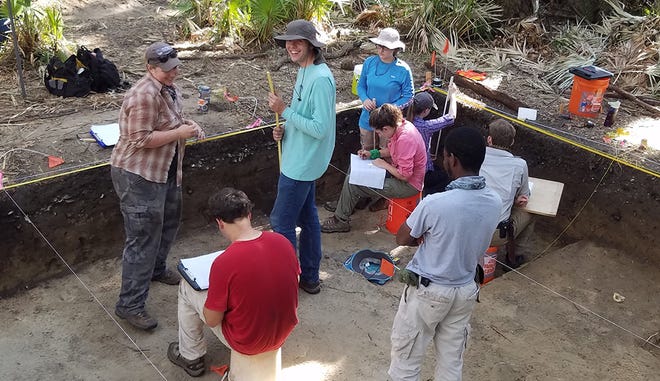 UGA archaeology students working on a dig at one of the shell ring village sites on Sapelo Island, about 70 miles south of Savannah, Georgia. During the period from 4,250 to 3,750 years ago, Native Americans founded three successive villages on the island.