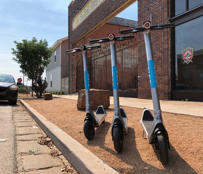 A nest of three Bird scooters is parked Monday in front of Moose Mountain Coffee Bar & Roastery at the SoDA District Courtyard in the 800 block of South Second Street.