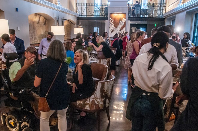Guests gather in the bar and dining room area as Ravello opened for a sneak peek on Friday, May 13, 2022, in downtown Montgomery. 