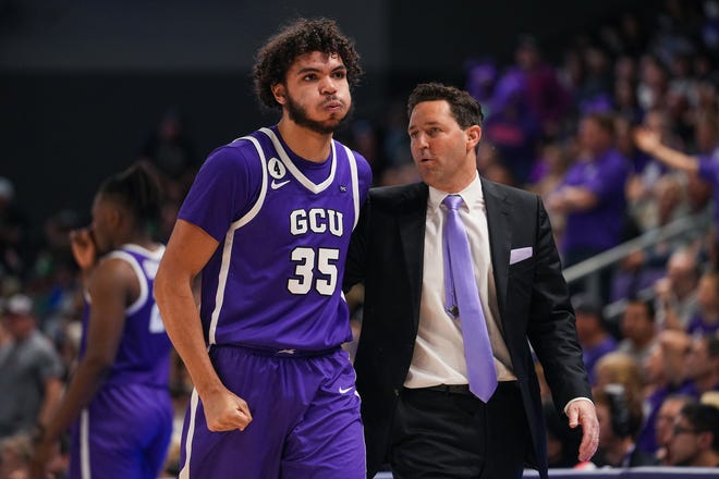 Grand Canyon Antelopes forward Taeshon Cherry (35), left, walks off after receiving a technical foul during the second half against New Mexico State on Saturday, Feb. 19, 2022, in Phoenix.