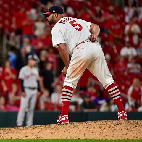 Albert Pujols pitches against the San Francisco Gi