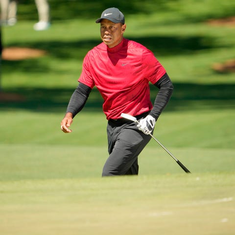 Tiger Woods walks to the No. 7 green during the fi