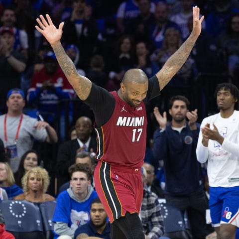 Heat forward P.J. Tucker (17) reacts after being c