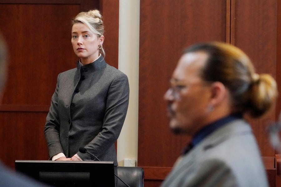 Amber Heard strongly denied an accusation from Depp that she left human fecal matter in the couple's bed after a fight.