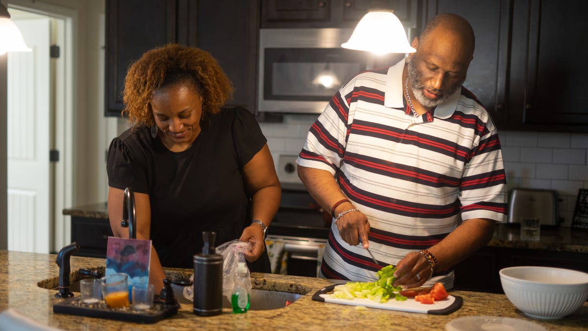 Cathy and Robert Smith preparing dinner for family. We meet with the Smith family at their home for a story on how inflation is affecting the ability to raise their children on May 13, 2022, in Hampton, GA.