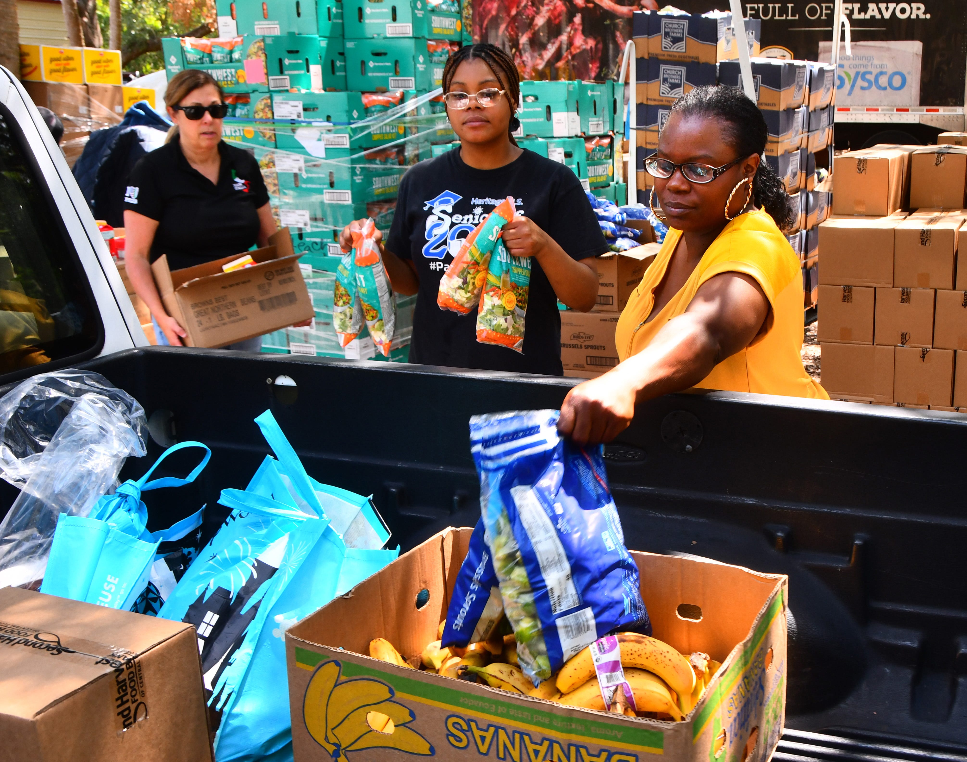 Sysco Foods partnered with Second Harvest and Hands for Healing to distribute 1000 meals and groceries in Palm Bay on May 17th. 