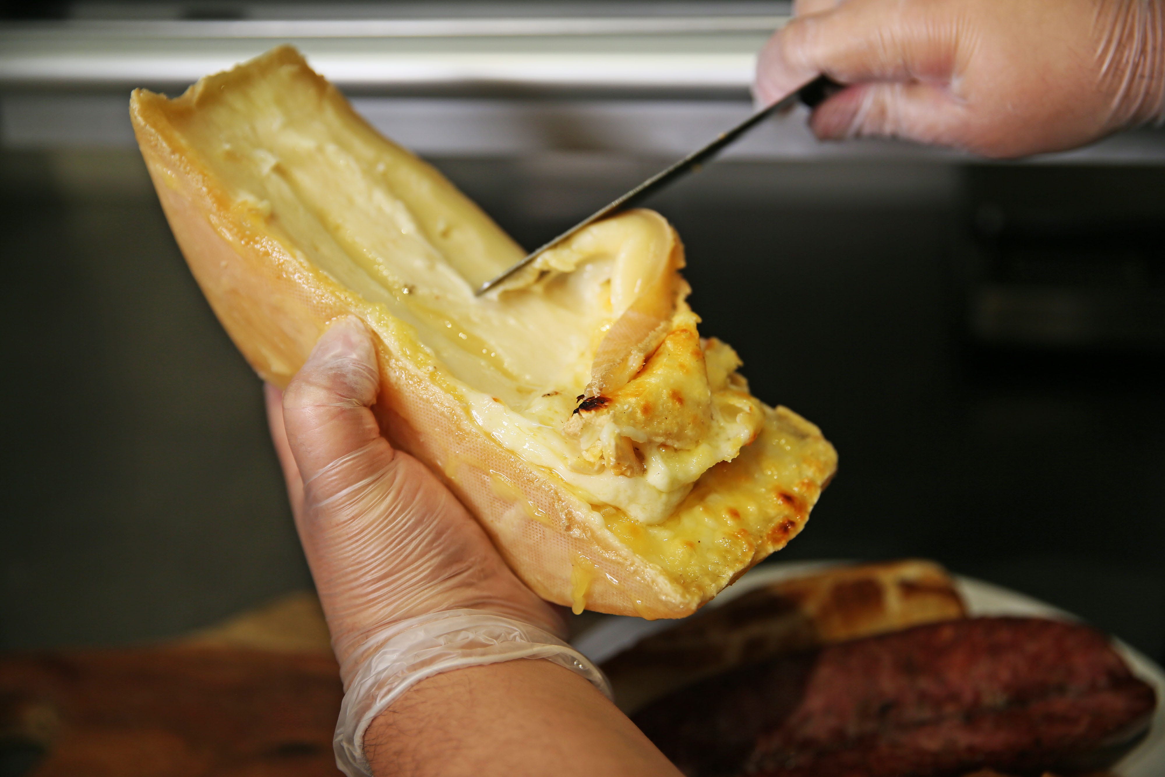 What to know about raclette, a French cheese drizzled over food