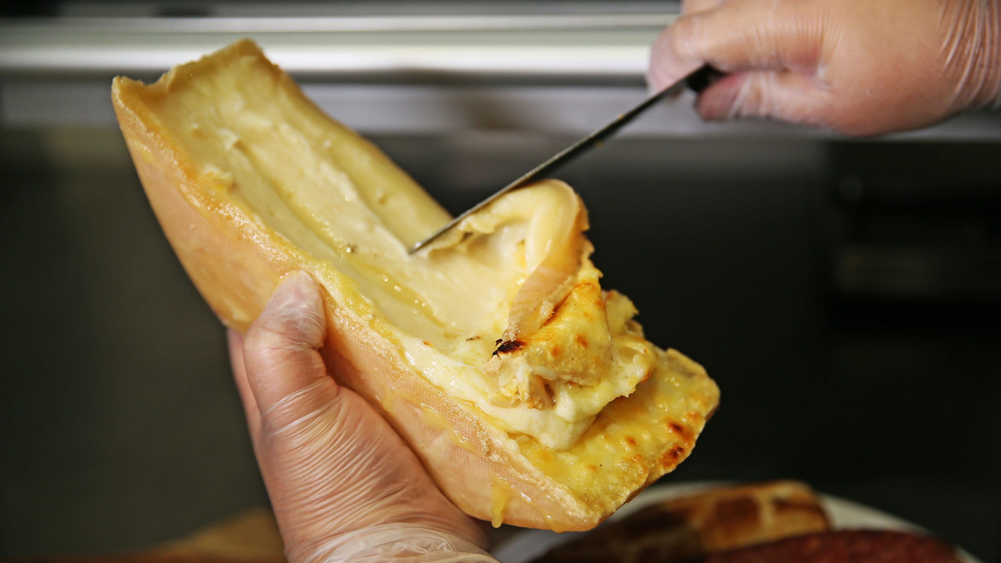 What to know about raclette, a French cheese drizzled over food