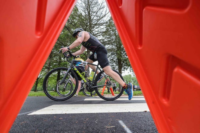 Cyclists get under way in the Bear Triathlon on May 15 at Lums Pond State Park.