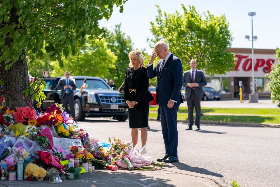 President Joe Biden and first lady Jill Biden visit the scene of a shooting at a supermarket to pay respects and speak to families of the victims of Saturday's shooting in Buffalo, N.Y., Tuesday, May 17, 2022.