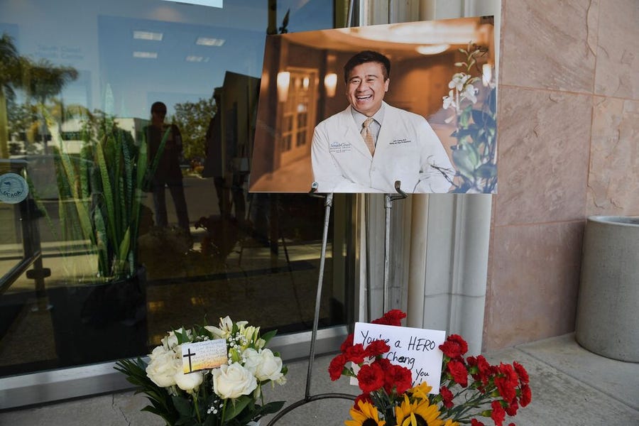 Flowers, cards and a photo of Dr. John Cheng were placed outside his office in Aliso Viejo, Calif., on May 16.