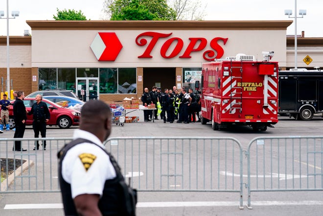 Investigators work the scene of a shooting at a supermarket, in Buffalo, N.Y., Monday, May 16, 2022. (AP Photo/Matt Rourke) ORG XMIT: NYMR105