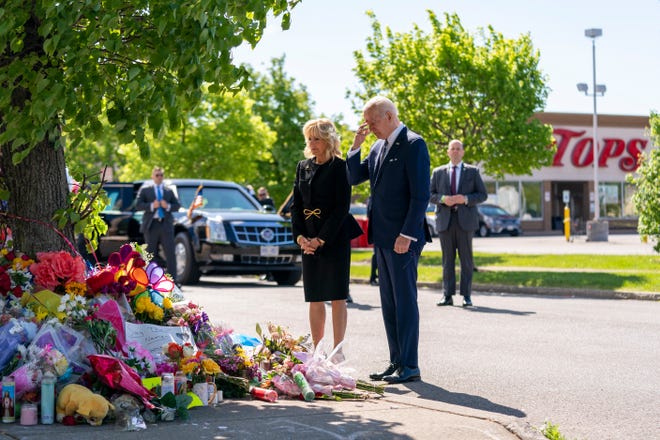 President Joe Biden and first lady Jill Biden visit the scene of a shooting at a supermarket to pay respects and speak to families of the victims of Saturday's shooting in Buffalo, NY, Tuesday, May 17, 2022. (AP Photo/Andrew Harnik)