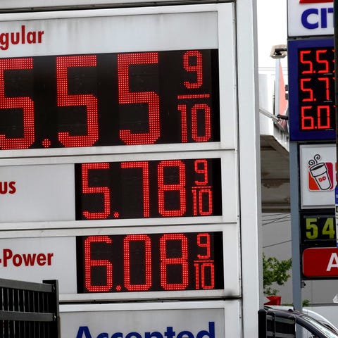 A sign displays gas prices at a gas station on May