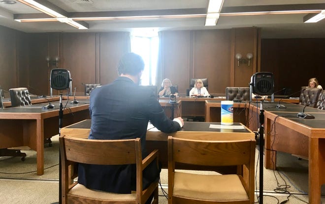 Assistant Attorney General Sean Locke testifies before a committee of conference in opposition to a “parental rights” bill, which he argues will require schools to illegally out trans students to their parents.