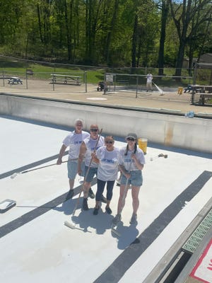 Volunteers from Kurz-Kasch recently helped repaint the pool at Cy Young Park, the second year that volunteers from the factory helped in the project.