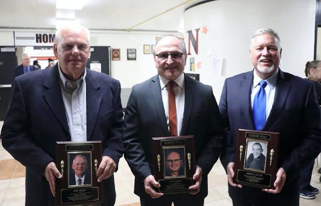 The Newcomerstown  Exempted Village School District inducted three new members for the Wall of Honor at the high school on May 12. Pictured, left to right, are Ron Hurst, Whit Parks and David Little, who accepted on behalf of his late father, Dr. Harry Little.
