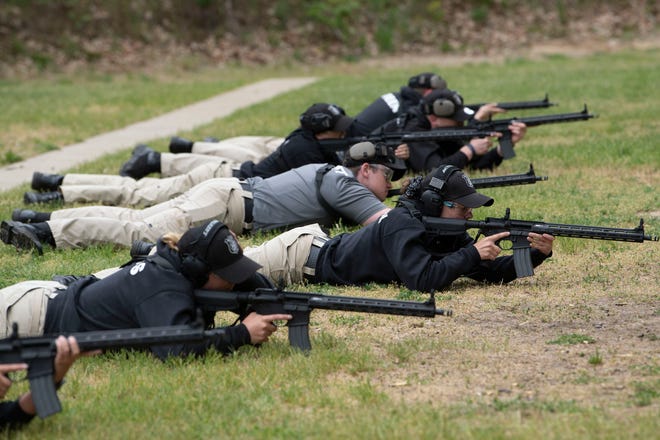 Kellogg Community College cadets practice at River Road Shooting Range in Battle Creek on Wednesday, May 18, 2022.