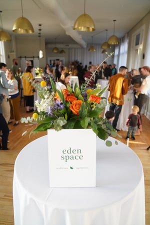 People celebrate during the launch party for Eden Space, an "online mindfulness garden" for those going through pregnancy and postpartum depression, on April 28 at Convolo in Sioux Falls.
