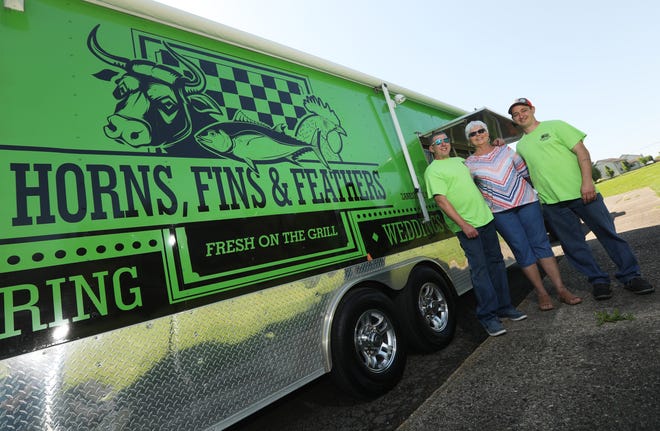 Brian Waller, left, his mother, Kim Gibson, and their long-time restaurant associate, Shawn Kirkpatrick, started the Horns Fins and Feathers food trailer last year. The trailer will be at the Jaycees' Food Truck Rally on Saturday.
