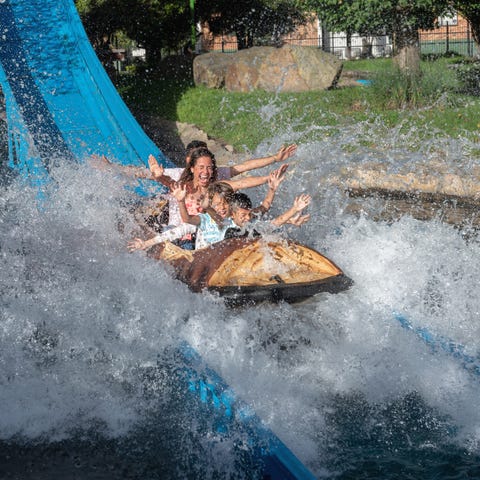 Happy Latin American family having fun and getting
