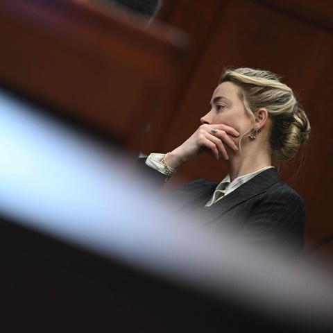 US actress Amber Heard looks on in the courtroom a
