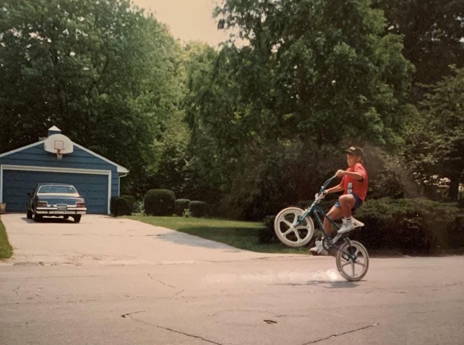 Clint Osthimer rides his bike in his Indiana neighborhood in the mid 1980s. Clint's best friend, Jeff Kennedy, wrote a screenplay about his life and their friendship.