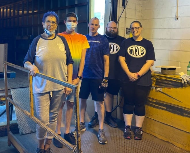 More than 18,000 pounds of food was collected by Monroe County postal carriers. Here, the Monroe County Opportunity Program Food Department Staff include:  Nola Young, Jacob Wilson, Meldrum MacPetrie, Jonas Lowe and Tamara Courts.