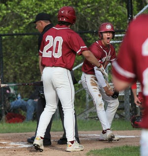 Portsmouth junior Matthew Minckler, center, was named to the Baseball Coaches Association of New Hampshire Division I all-state first team.