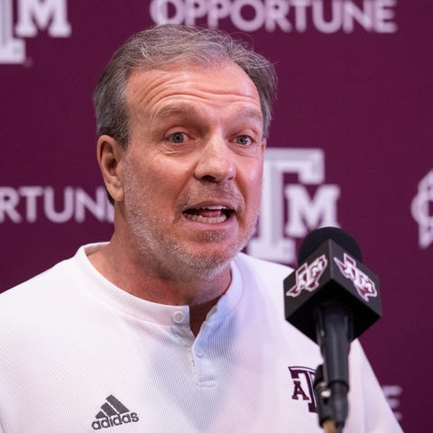 Texas A&M head coach Jimbo Fisher speaks with the 